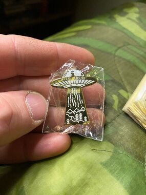 Brand New In Package Strike Gently Rise Above UFO Enamel Pin Gold/White Variant